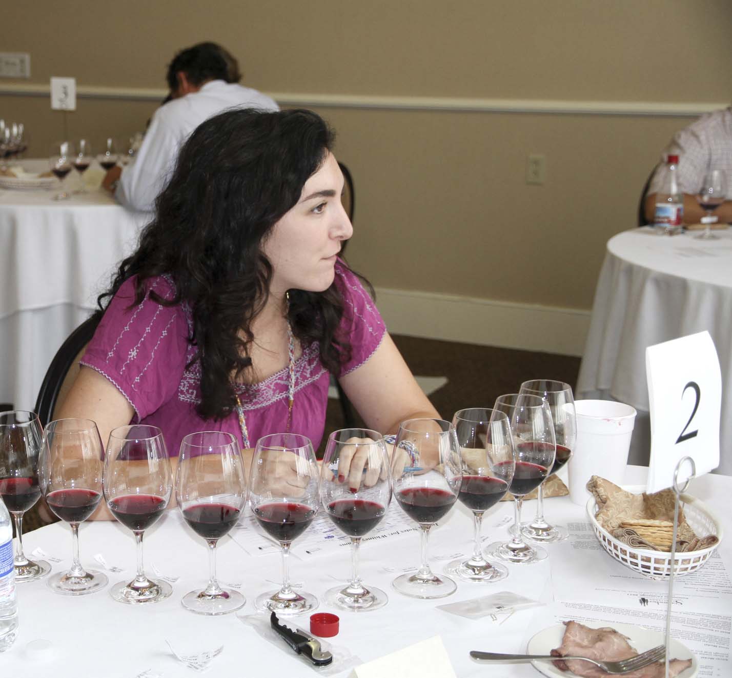 Whitney Adams of Terroni in Los Angeles prepares to analyze a flight of reds.