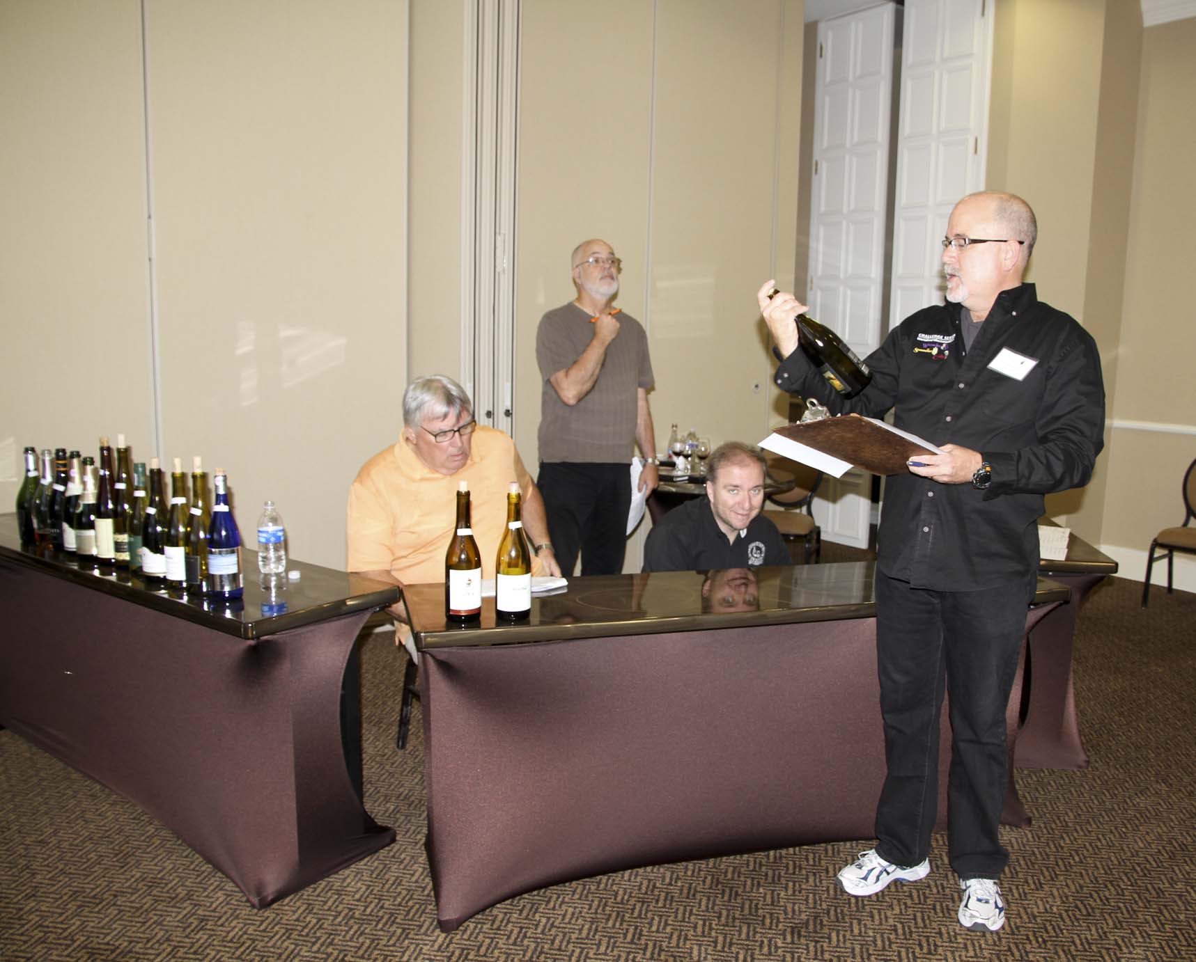 Assistant Director Rick Cook unveils a Platinum winner in the final round of voting.